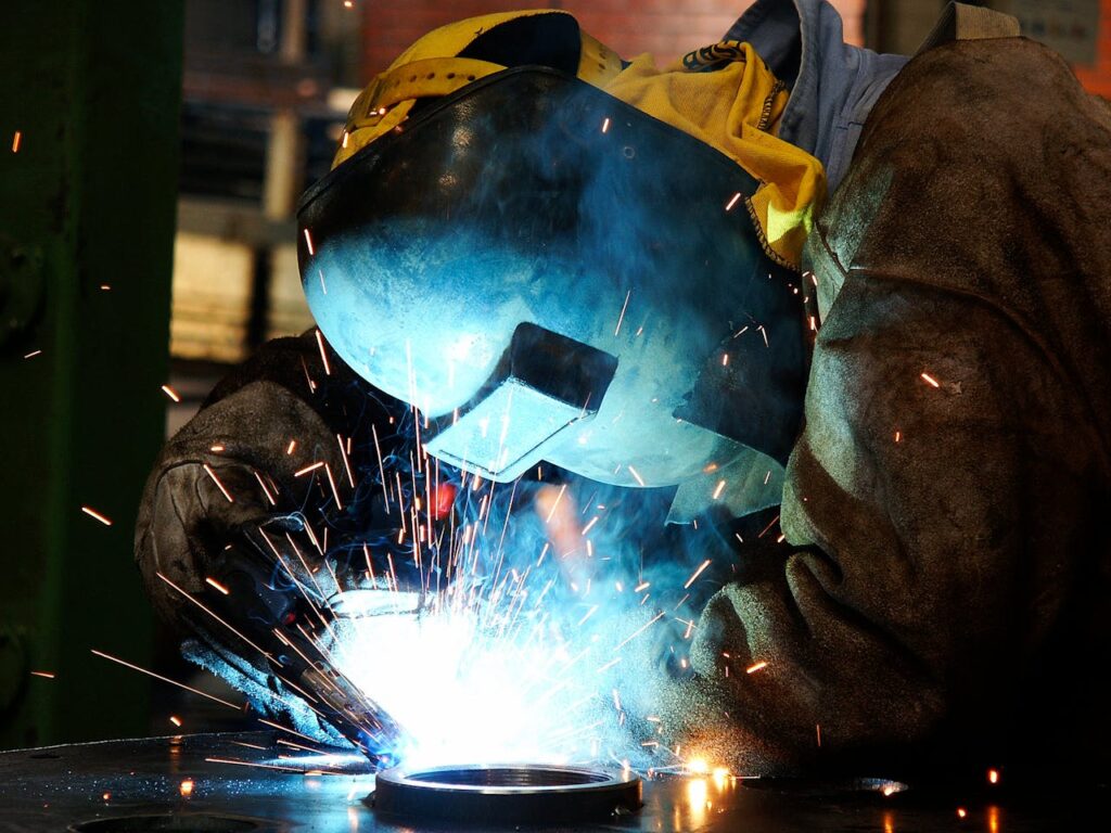 Welder Wearing a Protective Helmet